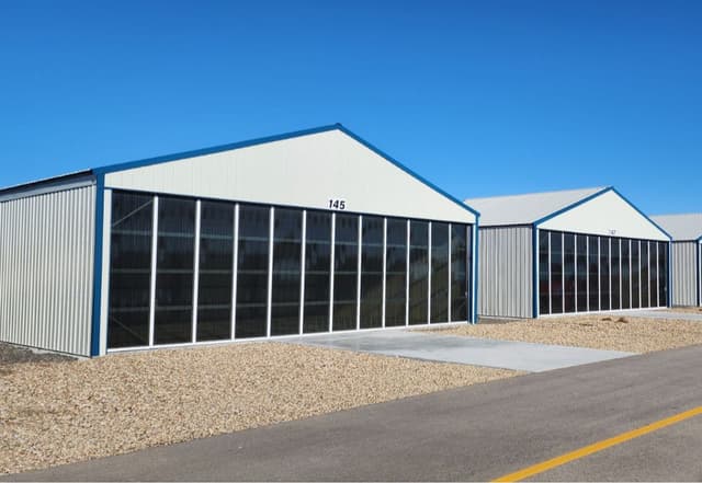 Newly built hangar 42x30 Manual double cantelever doors with tinted glass 1