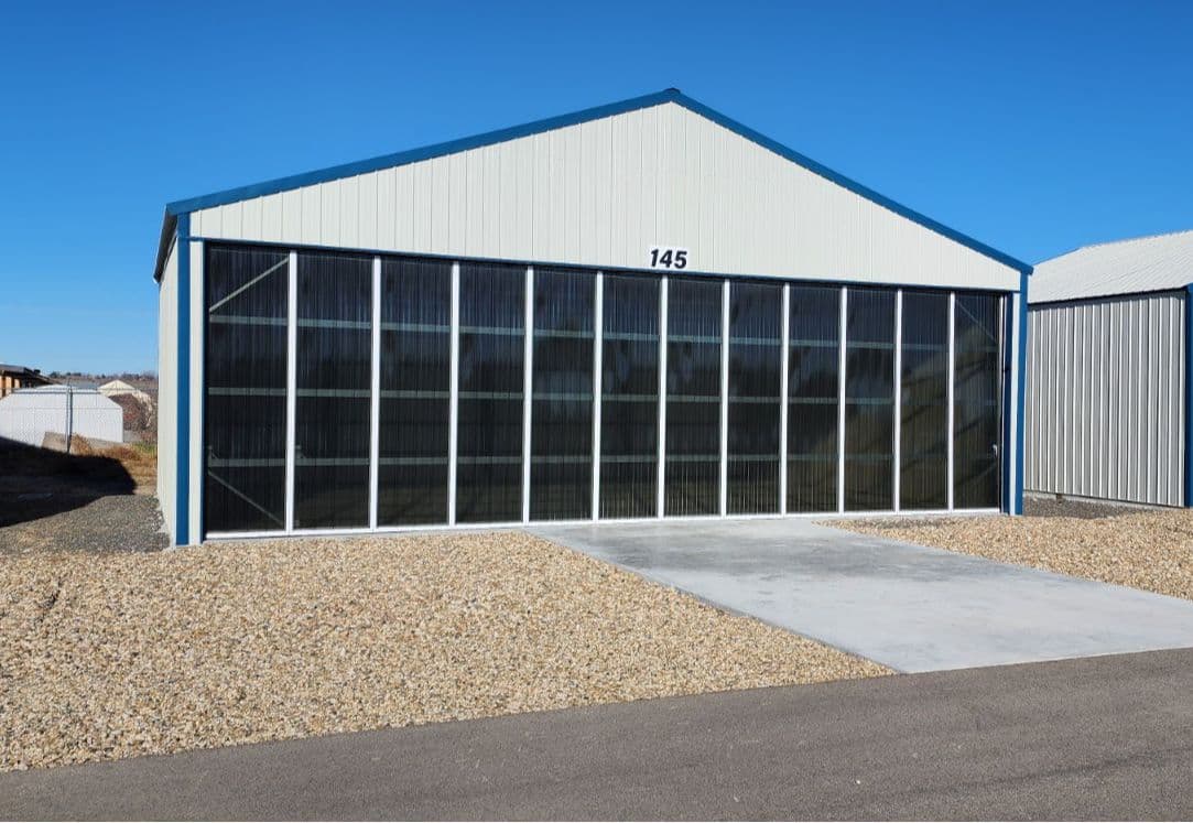 Newly built hangar 42x30 Manual double cantelever doors with tinted glass 3